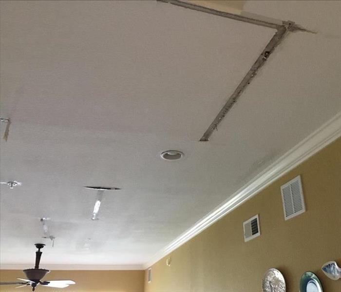 ceiling with pieces of drywall missing