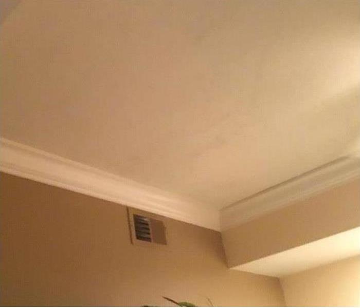 ceiling with water damage after a storm